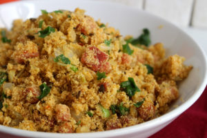 A close-up view of a bowl of Brazilian Toasted Manioc Flour (Farofa).