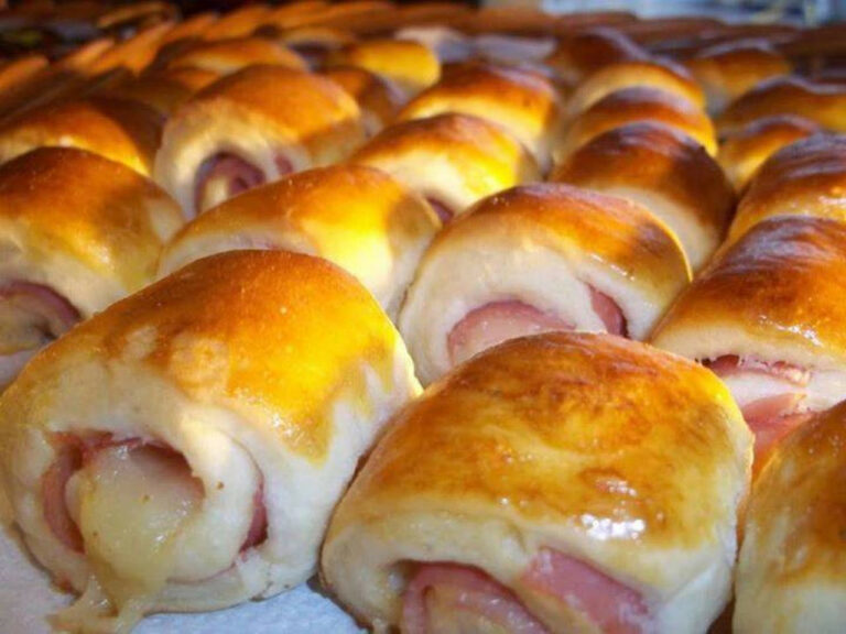 Freshly baked Ham and Cheese Knee Bread glistening with a golden egg wash, ready to be devoured.